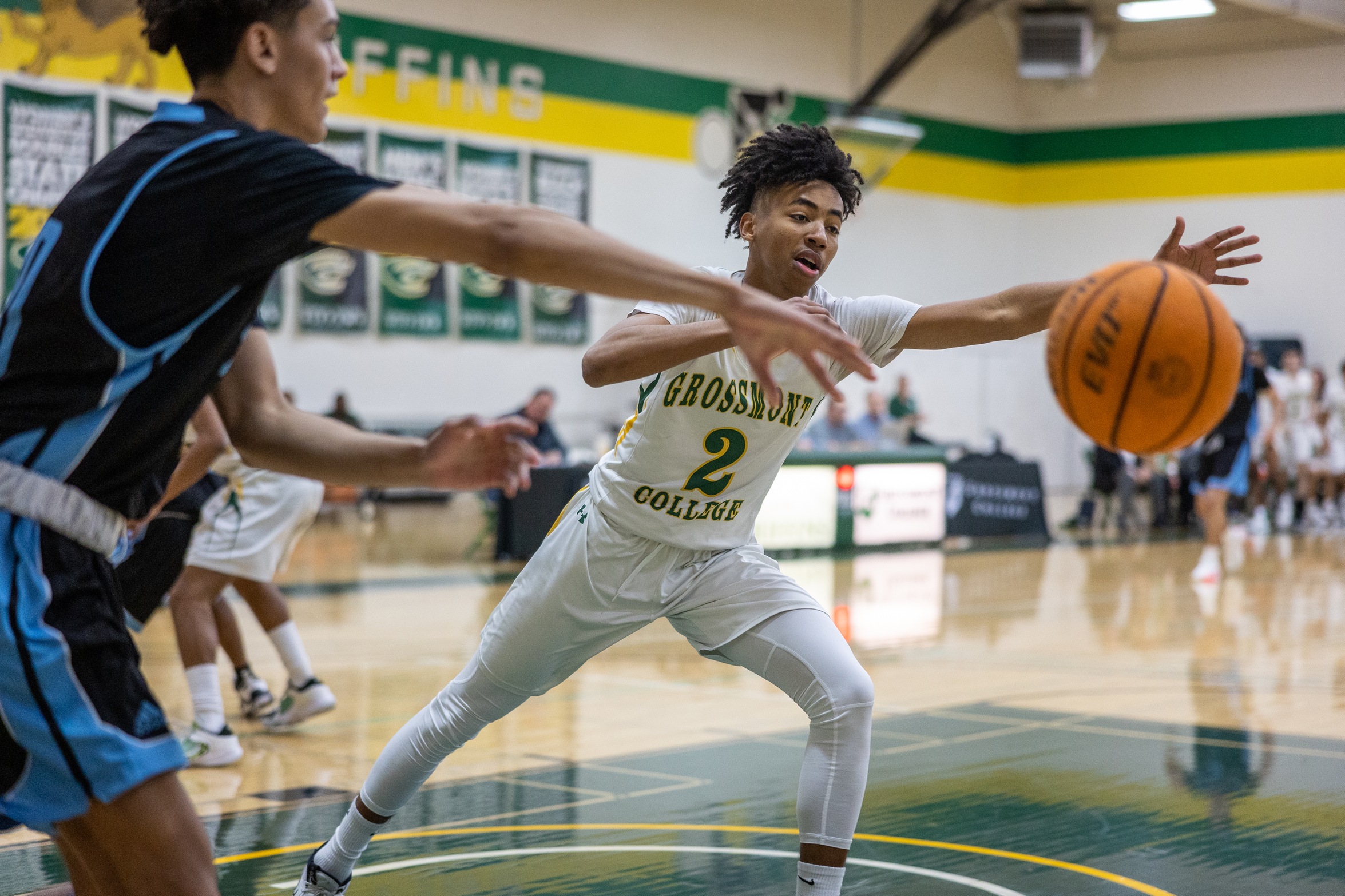 Tyrone Lester Jr. reaches for the ball against Cuyamaca (1/13/2023).  Photo Courtesy of P.J. Panebianco (@vanillagorillaphotography on Instagram).
