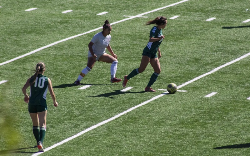 Emma Gorrence looking to pass (eventually to Jesseka Staton (#10)) for a Griffin Goal.  Photo Courtesy of Griffin Athletics.